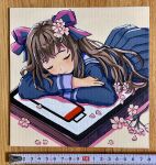  1girl absurdres acrylic_paint_(medium) battery_indicator blue_serafuku blue_shirt blue_skirt bow brown_hair cellphone closed_eyes closed_mouth commentary_request cowboy_shot dated_commentary flower hair_bow hair_ornament highres long_hair lying on_stomach original oversized_object painting_(medium) phone photo_(medium) school_uniform serafuku shirt skirt sleeping smartphone solo traditional_media two-tone_bow user_znxw3823 white_flower 