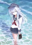  1girl absurdres anchor_symbol birthday blue_eyes blue_hat blue_sailor_collar blue_skirt blush brown_shoes caustics collarbone commentary_request crossed_bangs flat_cap from_above full_body genjaku grey_hair hair_between_eyes happy_birthday hat hat_pin hibiki_(kancolle) highres holding holding_shoes holding_unworn_clothes kantai_collection loafers long_hair long_sidelocks long_sleeves looking_at_viewer miniskirt missing_legwear neckerchief pleated_skirt red_neckerchief sailor_collar school_uniform serafuku shoes sidelocks skirt smile solo thighs unworn_shoes very_long_hair wading water waves 