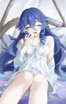 1girl alternate_costume blue_hair breasts commentary_request detached_sleeves feet_out_of_frame genshin_impact hair_between_eyes highres knees_up layla_(genshin_impact) long_hair looking_at_viewer medium_breasts nightgown on_bed one_eye_closed pillow pointy_ears sitting solo taira_(taira_oekaki) twitter_username very_long_hair white_nightgown yawning 