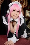  1girl asian cosplay headphones nitroplus photo pink_hair plump solo super_sonico super_sonico_(cosplay) wakamu 