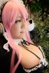  1girl asian cosplay headphones nitroplus photo pink_hair plump solo super_sonico super_sonico_(cosplay) wakamu 