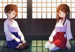  akagi_(kantai_collection) amemiya_ruki black_legwear brown_eyes brown_hair hakama_skirt japanese_clothes kaga_(kantai_collection) kantai_collection long_hair miko multiple_girls side_ponytail sitting smile thighhighs white_legwear 