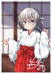  1girl alternate_costume black_ribbon blurry blurry_background blush commentary_request depth_of_field eyebrows_visible_through_hair eyes_visible_through_hair fusuma grey_hair hair_between_eyes hair_ribbon hakama highres japanese_clothes konno_junko long_hair looking_at_viewer low_twintails miko miyabi_(miyabeeya) ribbon ribbon-trimmed_sleeves ribbon_trim sleeves_past_wrists sliding_doors smile solo twintails wide_sleeves zombie_land_saga 