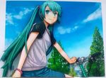  aqua_eyes aqua_hair bicycle earphones female hatsune_miku long_hair looking_back mk2_kuro96 nature outdoors sky smile solo twintails vocaloid 