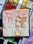  1girl absurdres art_tools_in_frame artist_name ascot bow breasts brown_hair chest_sarashi closed_mouth commentary dated detached_sleeves frilled_bow frilled_hair_tubes frills hair_bow hair_tubes hakurei_reimu highres long_hair looking_at_viewer mai_kao_chang_de_a_yi painting_(medium) photo_(medium) red_bow red_eyes sarashi shikishi small_breasts smile solo touhou traditional_media upper_body watercolor_(medium) yellow_ascot 