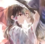  black_hair blonde_hair blush bow brown_hair commentary_request detached_sleeves face-to-face hair_bow hair_tubes hakurei_reimu hand_on_another's_hat hat imminent_kiss kayako_(tdxxxk) kirisame_marisa multiple_girls touhou witch_hat yellow_eyes yuri 