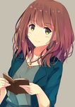  blush book brown_hair collarbone eyebrows_visible_through_hair green_eyes highres holding holding_book jewelry looking_at_viewer medium_hair mole mole_under_eye necklace open_book original smile solo sutorora upper_body 