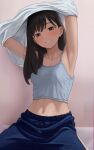  1girl absurdres armpits black_hair blue_camisole blue_pants breasts brown_eyes camisole clothes_lift commentary_request grin highres kagari_ds lifting_own_clothes light_blush light_particles long_hair looking_at_viewer loose_hair_strand medium_breasts midriff mole mole_under_eye navel original paid_reward_available pants shirt shirt_lift sitting smile solo track_pants undressing white_shirt 