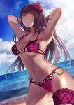  absurdres arms_behind_head arms_up bad_proportions breasts brown_hair cleavage closed_mouth fate/grand_order fate_(series) flower hair_flower hair_ornament highres karinto_yamada large_breasts long_hair looking_at_viewer navel red_eyes scathach_(fate)_(all) scathach_(swimsuit_assassin)_(fate) solo swimsuit 