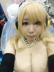  1girl asian blonde_hair breasts brown_eyes cleavage cosplay fat headphones hoshima_mika huge_breasts nitroplus photo solo super_pochaco super_pochaco_(cosplay) 