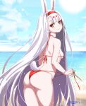  1girl animal_ears ass azur_lane beach bikini bikini_pull breasts brown_eyes clothes_pull cloud from_behind hairband highres leaning_forward long_hair looking_at_viewer looking_back ocean outdoors pulled_by_self rabbit_ears rabbit_girl rabbit_tail red_bikini shimakaze_(azur_lane) side-tie_bikini_bottom sideboob sky small_breasts smile solo standing swimsuit tail thighs umyonge_(lkakeu) untied_bikini very_long_hair 