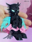 angry anoraknr arthropod blue_eyes bottomwear changeling clothing fangs friendship_is_magic hasbro hi_res holding_character hole_(anatomy) insect_wings my_little_pony photo_background photography_(artwork) pink_bottomwear pink_clothing pink_skirt real skirt teeth wings