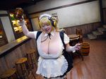  1girl asian blonde_hair breasts brown_eyes cleavage cosplay fat headphones hoshima_mika huge_breasts jewelry necklace nitroplus photo solo star super_pochaco super_pochaco_(cosplay) twintails 