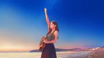  acoustic_guitar arm_up bare_arms beach black_hair blue_skirt blurry brown_eyes cowboy_shot depth_of_field ears from_side guitar highres instrument lips long_hair looking_to_the_side nose ocean original outdoors parted_lips shirt signature skirt sky sleeveless sleeveless_shirt solo standing star_(sky) starry_sky sunset town wayne_chan 