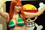  1girl big_breasts bikini breasts cleavage cosplay long_hair nami_(one_piece) nami_(one_piece)_(cosplay) one_piece photo red_hair thot underboob 
