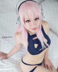  1girl breasts cosplay headphones hitomi_tanaka koneeko photo pink_hair solo super_sonico 