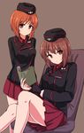  arms_behind_back bangs black_jacket book brown_background brown_eyes brown_hair chawan_(yultutari) commentary_request dress_shirt garrison_cap girls_und_panzer hat highres holding holding_book jacket kuromorimine_military_uniform long_sleeves looking_at_viewer military military_uniform miniskirt multiple_girls nishizumi_maho nishizumi_miho open_book pleated_skirt red_shirt red_skirt shirt short_hair simple_background sitting skirt uniform 