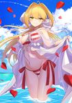  ahoge bad_id bad_pixiv_id bead_bracelet beads bikini blonde_hair blue_sky blush bracelet breasts closed_mouth cloud day fate/grand_order fate_(series) green_eyes highres jewelry kinsenka_momi long_hair looking_at_viewer medium_breasts nero_claudius_(fate)_(all) nero_claudius_(swimsuit_caster)_(fate) ocean petals side-tie_bikini sky smile solo standing striped striped_bikini swimsuit twintails wading water 