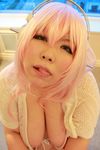  1girl asian cosplay fat headphones luu_(cosplayer) nitroplus photo pink_hair solo super_sonico super_sonico_(cosplay) 