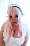  1girl breasts cosplay fat female huge_breasts luu_(cosplayer) nitroplus photo pink_hair solo super_sonico super_sonico_(cosplay) 