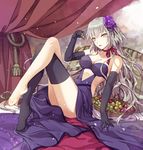  bangs bare_shoulders black_gloves blue_dress breasts collarbone crossed_legs curtains dress elbow_gloves eyebrows_visible_through_hair fate/grand_order fate_(series) flower food fruit gloves grapes grey_eyes grey_hair hair_flower hair_ornament highres holding jeanne_d'arc_(alter)_(fate) jeanne_d'arc_(fate)_(all) jh long_hair looking_at_viewer medium_breasts parted_lips pillow purple_flower single_thighhigh solo thighhighs thighs tsurime very_long_hair wavy_hair yellow_eyes 