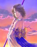  back bare_shoulders blue_dress brown_hair cloud commentary_request detached_sleeves dress final_fantasy final_fantasy_x heterochromia holding holding_staff looking_back outdoors short_hair solo staff sunset takeda_yuuko yuna_(ff10) 