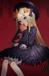  abigail_williams_(fate/grand_order) bad_id bad_pixiv_id black_dress blonde_hair blue_eyes bow dress fate/grand_order fate_(series) gambe hair_bow hat highres long_hair long_sleeves looking_at_viewer sleeves_past_wrists solo stuffed_animal stuffed_toy teddy_bear 
