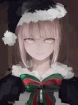  artoria_pendragon_(all) bangs black_capelet blonde_hair bow bowtie capelet closed_mouth eyebrows_visible_through_hair fate/grand_order fate_(series) fur_trim green_neckwear hat looking_at_viewer red_neckwear santa_alter santa_costume santa_hat short_hair smile solo upper_body wataichi_meko yellow_eyes 