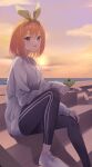  1girl :d backlighting black_pants blue_eyes blush casual cellphone commentary earphones eyelashes go-toubun_no_hanayome green_ribbon grey_sweater hair_between_eyes hair_ribbon heart highres holding holding_phone knees_up looking_at_viewer medium_hair nakano_yotsuba ocean open_mouth orange_hair orange_sky outdoors pants phone profnote ribbon sitting sky sleeves_past_wrists smartphone smile solo spoken_heart sunset sweater 