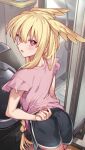 1girl ass black_shorts blonde_hair blush dolphin_shorts fate/grand_order fate_(series) head_wings highres long_hair looking_at_viewer looking_back mitsurugi_sugar open_mouth pink_shirt red_eyes shirt short_sleeves shorts sidelocks solo thrud_(fate) valkyrie_(fate) washing_machine wings 