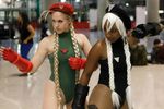  2girls alternate_color alternate_costume asian blonde_hair cammy_white cammy_white_(cosplay) capcom cosplay dark_skin hat leotard military military_uniform multiple_girls non-asian palette_swap revealing_clothes street_fighter white_hair 