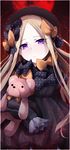  abigail_williams_(fate/grand_order) bad_id bad_pixiv_id bangs black_bow black_dress black_hat blonde_hair blush bow closed_mouth dress fate/grand_order fate_(series) forehead hair_bow hat head_tilt highres long_hair long_sleeves looking_at_viewer object_hug orange_bow parted_bangs polka_dot polka_dot_bow purple_eyes red_sun sleeves_past_fingers sleeves_past_wrists solo stuffed_animal stuffed_toy teddy_bear very_long_hair wada_kazu 