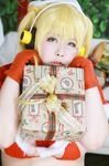  1girl asian blonde_hair breasts brown_eyes cosplay fat headphones huge_breasts luu_(cosplayer) nitroplus photo santa_hat santa_outfit solo super_pochaco super_pochaco_(cosplay) twintails 
