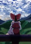  1girl absurdres bare_shoulders bow brown_hair cloud cloudy_sky commentary_request day detached_sleeves facing_away frilled_bow frills gasubanana hair_bow hakurei_reimu highres hill long_sleeves medium_hair mountainous_horizon no_lineart outdoors partial_commentary red_bow red_skirt red_vest ribbon-trimmed_sleeves ribbon_trim sitting skirt skirt_set sky solo touhou vest white_sleeves wide_sleeves 