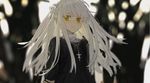  bangs black_dress blurry blurry_background closed_mouth cross cross_necklace depth_of_field dress green_eyes hirota_tsuu jewelry long_sleeves looking_at_viewer necklace original solo two_side_up upper_body white_hair 
