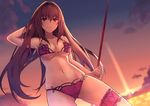  bikini breasts commentary_request fate/grand_order fate_(series) flower gae_bolg hair_flower hair_ornament hibiscus kurifuto large_breasts leg_garter long_hair looking_at_viewer navel pink_bikini purple_bikini purple_hair red_eyes scathach_(fate)_(all) scathach_(swimsuit_assassin)_(fate) smile solo swimsuit thigh_strap twilight 