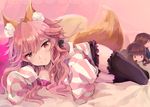  alternate_costume animal_ears black_legwear black_scrunchie breast_press brown_eyes character_doll fate/extra fate/extra_ccc fate_(series) fox_ears fox_tail highres hood hoodie jewelry kishinami_hakuno_(female) kishinami_hakuno_(male) long_hair lying mitu-yuki necklace pink_hair scrunchie sleeves_past_wrists smile solo striped_hoodie tail tamamo_(fate)_(all) tamamo_no_mae_(fate) thighhighs wavy_hair 