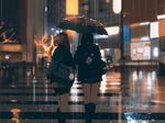  bag blurry blurry_background city commentary crosswalk depth_of_field from_behind holding holding_umbrella multiple_girls night original rain reflection road scenery shared_umbrella skirt snatti standing street umbrella wet 