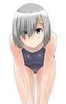  30-06 blue_eyes breasts competition_school_swimsuit eyes_visible_through_hair hair_ornament hair_over_one_eye hairclip hamakaze_(kantai_collection) highres kantai_collection looking_at_viewer medium_breasts one-piece_swimsuit school_swimsuit short_hair silver_hair smile solo standing swimsuit white_background 