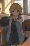  1girl absurdres blonde_hair blue_overskirt blue_vest blush braid cellphone classroom commentary fujita_kotone gakuen_idolmaster hair_ribbon highres holding holding_phone idolmaster jacket light_smile long_hair long_sleeves looking_at_viewer multicolored_clothes multicolored_jacket nnmbpx phone pleated_skirt ribbon skirt solo twin_braids vest yellow_eyes 