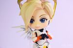  1girl armor blonde_hair blue_eyes body_suit figure hair_ornament mechanical_halo mercy_(overwatch) nendoroid overwatch photo smile solo wings 
