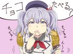  beret blue_eyes chocolate commentary_request epaulettes food food_on_face hair_between_eyes hat heart holding holding_food ishii_hisao jacket kantai_collection kashima_(kantai_collection) kerchief long_sleeves red_neckwear short_hair silver_hair solo translation_request two_side_up white_jacket 