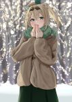  1girl absurdres alternate_costume bare_tree blonde_hair blue_eyes blurry blurry_background breathing_on_hands brown_coat coat cold commentary_request crossed_bangs green_scarf green_skirt hair_between_eyes hair_ornament highres hololive kamisaka_shyou kazama_iroha leaf_hair_ornament long_hair long_skirt outdoors pokobee ponytail scarf skirt solo tanuki_print tree virtual_youtuber warming_hands winter winter_clothes 