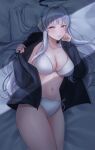  1girl absurdres bed_sheet black_jacket blue_archive blush bra breasts collarbone cowboy_shot grey_hair halo highres jacket kangse415 large_breasts light_smile long_hair long_sleeves looking_at_viewer mechanical_halo navel noa_(blue_archive) open_clothes open_jacket panties pillow purple_eyes side-tie_panties solo tongue tongue_out underwear white_bra 