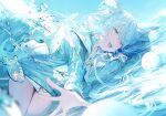  1girl :d absurdres blue_eyes blue_hair blue_jacket blue_theme curled_horns day highres horns jacket long_hair long_sleeves looking_at_viewer lying on_side original outdoors scan sharp_teeth smile solo teeth umibouzu_(niito) water waves 