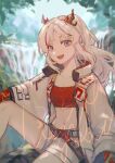  1girl :d arknights bandeau blurry blurry_background chinese_commentary collared_jacket commentary_request day dragon_girl dragon_horns highres horns jacket knee_up long_hair looking_at_viewer midriff multicolored_hair navel nian_(arknights) open_clothes open_jacket open_mouth outdoors pink_eyes red_bandeau red_hair shorts sitting smile solo sparklings_(1234_hen_hao_chi) streaked_hair watermark white_hair white_jacket white_shorts 