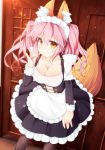  1girl alternate_costume animal_ear_fluff animal_ears apron black_legwear breasts cleavage collarbone enmaided fang fate/extra fate/grand_order fate_(series) fox_ears fox_girl fox_shadow_puppet fox_tail frills indoors large_breasts looking_at_viewer maid maid_apron maid_headdress pink_hair puffy_sleeves solo tail tamamo_(fate)_(all) tamamo_no_mae_(fate) torii_(kedamatori) twintails waist_apron yellow_eyes 