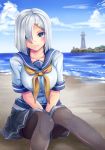  beach black_legwear blue_eyes blue_sky breasts building cloud cloudy_sky day gloves hair_ornament hair_over_one_eye hairclip hamakaze_(kantai_collection) highres kantai_collection large_breasts lighthouse neckerchief ocean outdoors pantyhose pleated_skirt school_uniform serafuku short_hair short_sleeves silver_hair skirt sky solo tree water white_gloves yellow_neckwear yumibakama_meme 