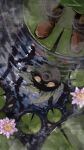  1boy 1other absurdres boots colored_sclera commentary deku_(zelda) deku_link different_reflection flower from_above gus_uur highres lily_pad link male_focus no_humans outdoors petals petals_on_liquid pink_flower pond rain reflection reflective_liquid ripples solo standing the_legend_of_zelda the_legend_of_zelda:_majora's_mask water watermark watermark_grid yellow_eyes yellow_sclera 
