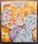 1girl animal_ears blonde_hair blush commentary dress fox_ears fox_tail hat highres kitsune long_sleeves looking_at_viewer lying masanaga_(tsukasa) mob_cap multiple_tails on_side open_mouth photo_(medium) red_eyes shikishi smile solo tail touhou traditional_media untranslatable_commentary white_dress yakumo_ran yellow_eyes 